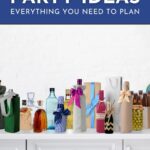 A variety of bottled drinks wrapped in gift bags and ribbons are arranged on a white counter under a sign that reads, "'Stock the Bar' Party Ideas," perfect for inspiring your next stock the bar party.