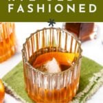 A glass of rye old fashioned with a large ice cube, surrounded by orange slices, with text overlay: "How to make a rye old fashioned. Get the recipe. feastandwest.com". Perfect your rye old fashioned at home!.