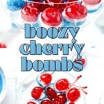 Cherries dipped in blue and white coating, arranged in a glass, with text "boozy cherry bombs.