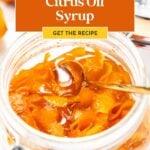 Glass jar filled with citrus oil syrup and orange peels, with a spoon inside. Banner reads "homemade oleo saccharum, Citrus Oil Syrup, Get the Recipe.