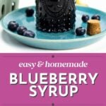 A bottle of blueberry syrup on a plate with blueberries, plus ingredients and syrup spooned on a white background.
