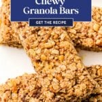 Close-up of chewy granola bars stacked on a white surface with a blue banner reading "Chewy Granola Bars.