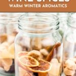 Glass jars filled with dried citrus, cinnamon sticks, and spices for making mulled wine, with text overlay.