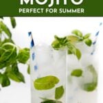 Two glasses of basil mojito with ice, basil leaves, and blue striped straws, garnished with fresh basil.