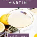 Lavender lemon drop martini in a glass, garnished with lavender, with lemons and lavender sprigs nearby.
