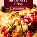 Close-up of strawberry crisp dessert with crumbly topping and juicy strawberry filling, text overlay on image.