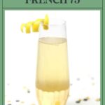 A French 75 cocktail in a gold-rimmed glass, garnished with a lemon twist, on a white background.