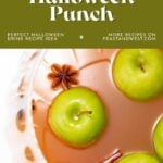 Bowl of punch with green apples, star anise, and cinnamon sticks, labeled “Poison Apple Halloween Punch.”.