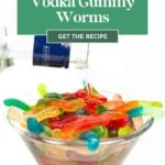 A clear bowl of gummy worms with vodka being poured over them; text reads “Vodka Gummy Worms recipe.”.