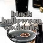 Two dark Halloween cocktails in stemmed glasses with a black sugar rim and dried citrus garnish.